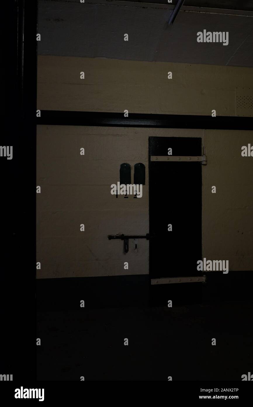 Cell 122 seen closed from a dark corridor Parramatta Gaol, Sydney, Australia Stock Photo