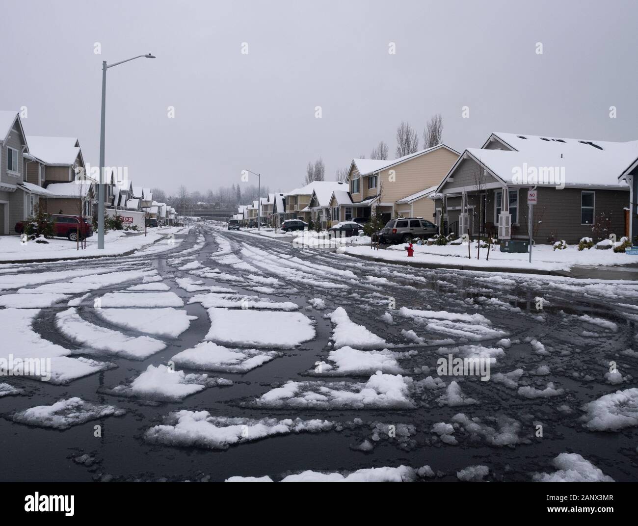 Snow covered road way after a winter storm, in Monroe,Washington,USA. Stock Photo