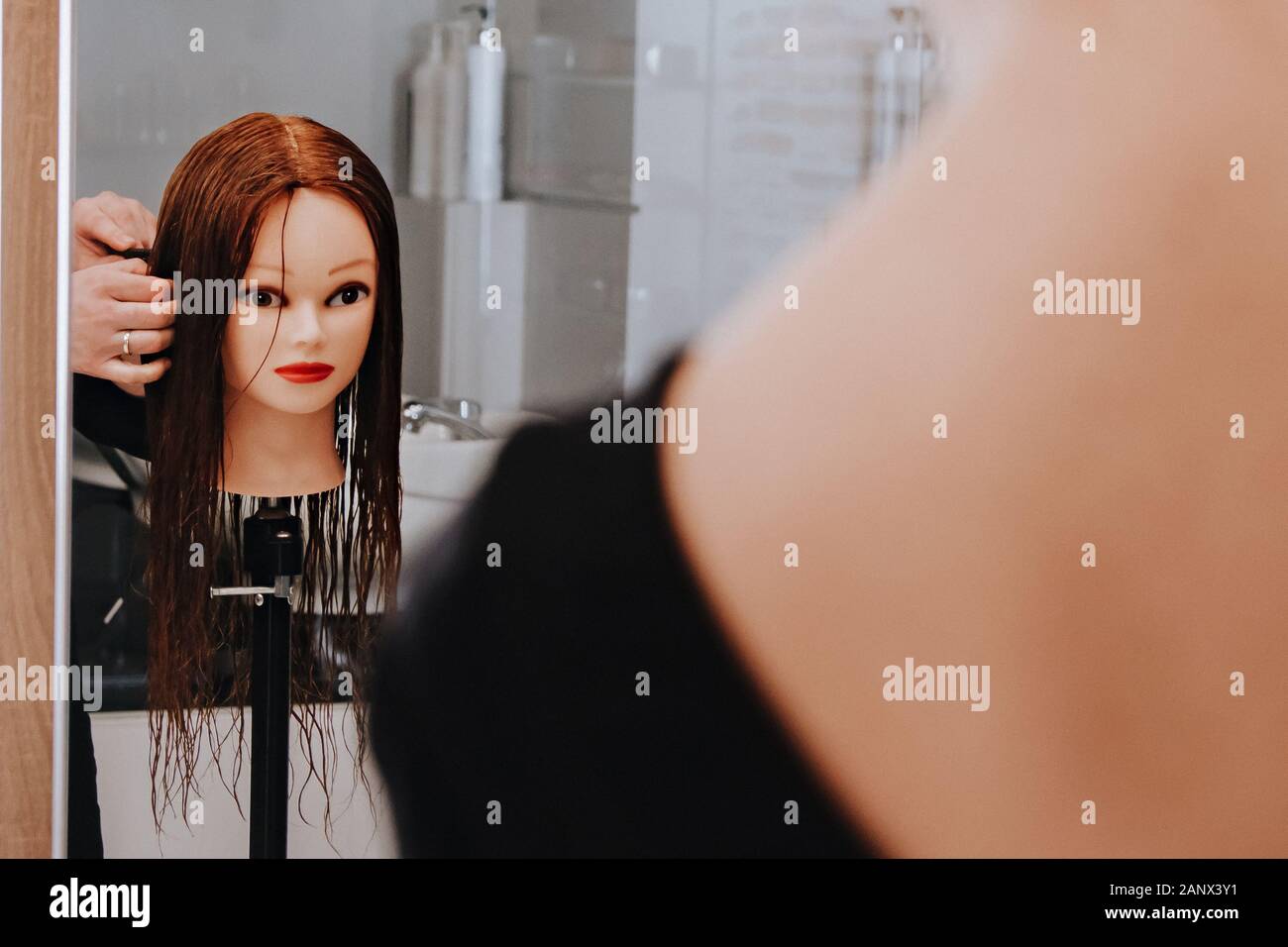 Hairdresser Student Studying On Mannequin Head At Salon Stock