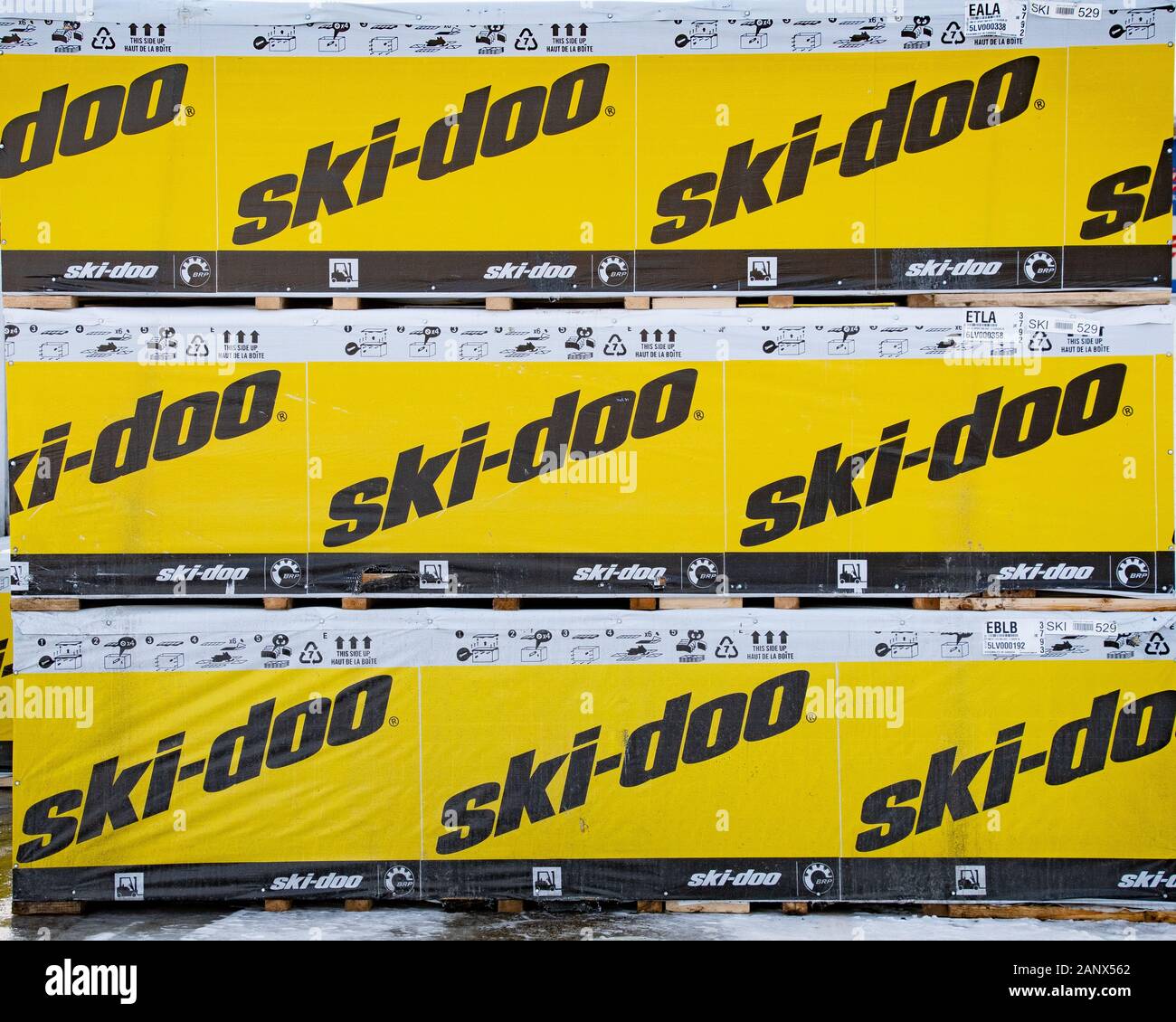 A pile of 3 shipping crates containing new ski-doo snowmobiles for sale at a dealer in Speculator, NY USA Stock Photo