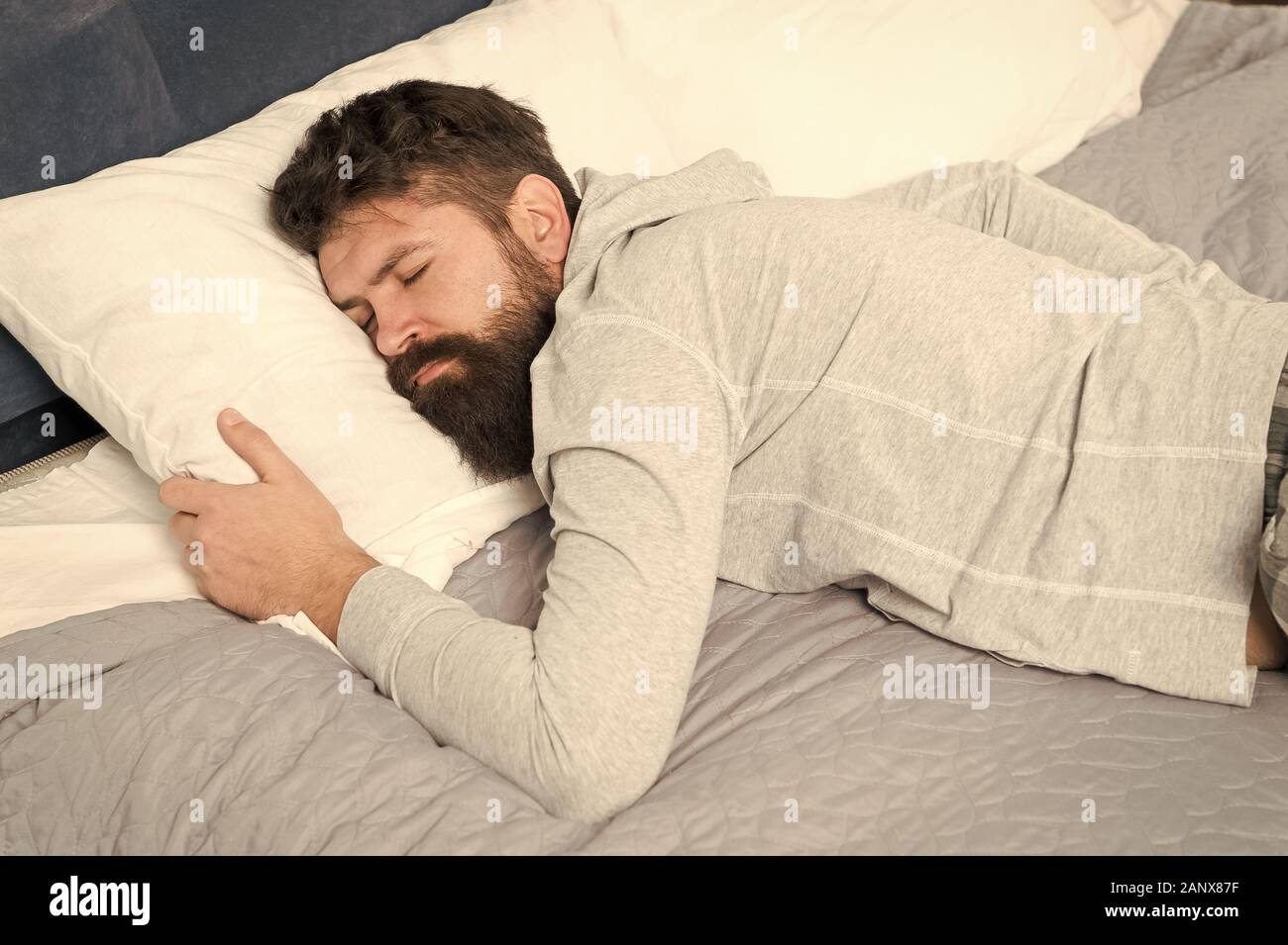 Sleep wake homeostasis keeps track of your need for sleep. Man at home ...