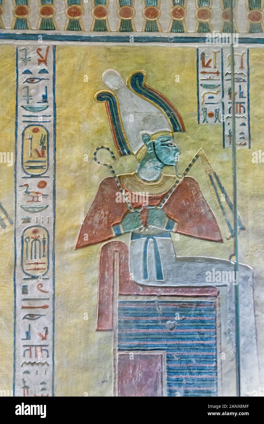 God Osiris seated on his throne, depicted as a green-skinned deity with a pharaoh's beard Stock Photo