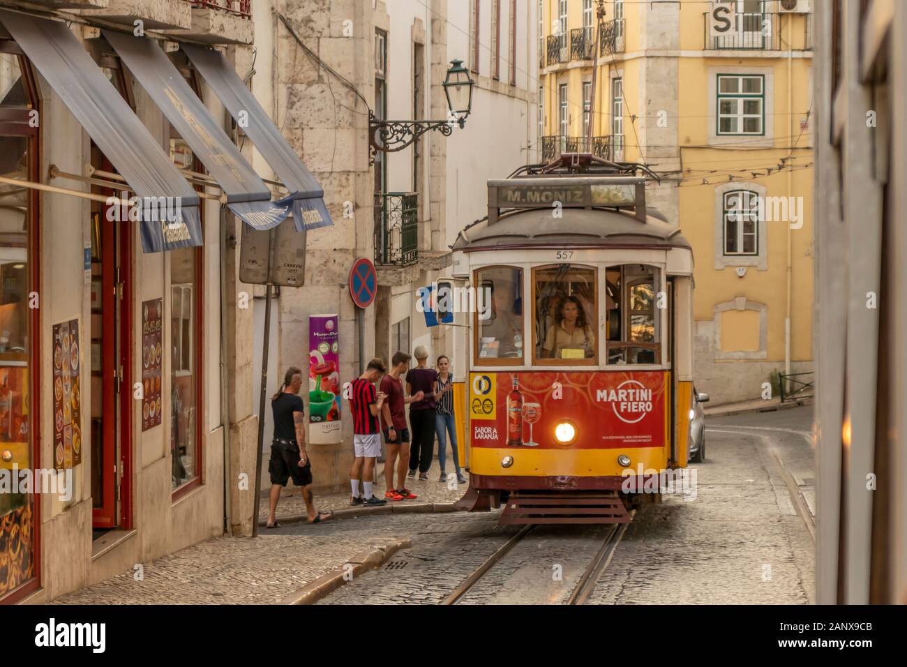 Lisbon Portugal - July 22, 2019: Passengers boarding the Number 28 tram to Martim Moniz in Lisbon City Centre, Portugal. Stock Photo