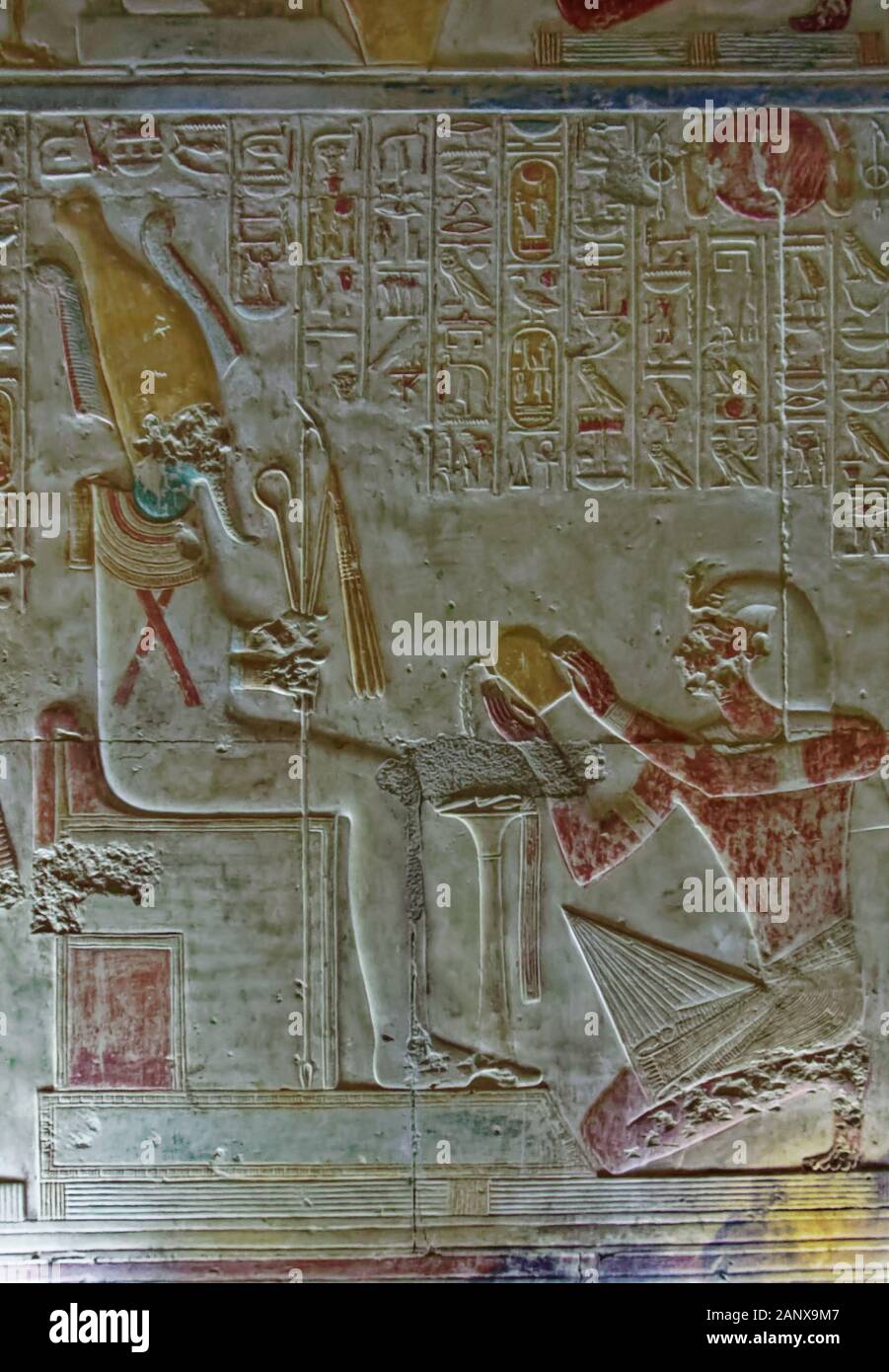 A frieze of Pharoah Seti offering libations to Osiris, from the North wall of the Chapel of Osiris at the Abydos Temple of King Seti I Stock Photo