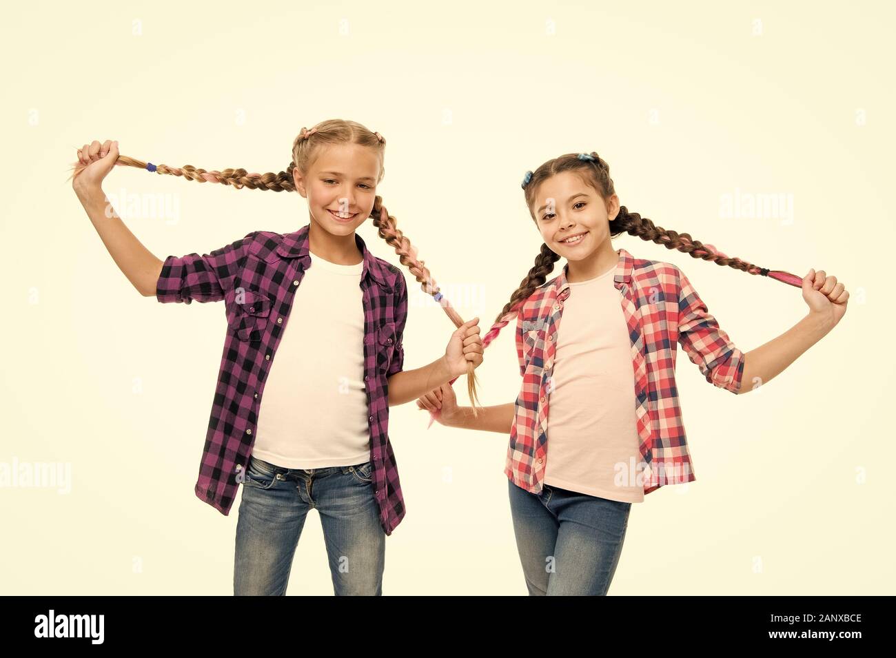Doing cute and easy hair style. Happy children hold long braided hair style. Small girls smile in casual fashion style. Keep your style. Fashion and beauty. Hair salon Stock Photo - Alamy Doing cute and easy hair style. Happy children hold long braided hair style. Small girls smile in casual fashion style. Keep your style. Fashion and beauty. Hair salon Stock Photo - Alamy