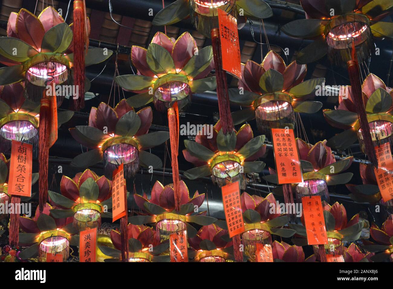 Looking up at lanterns hanging from the ceiling of the Tam Kung Temple at Shau Kei Wan in Hong Kong. Stock Photo