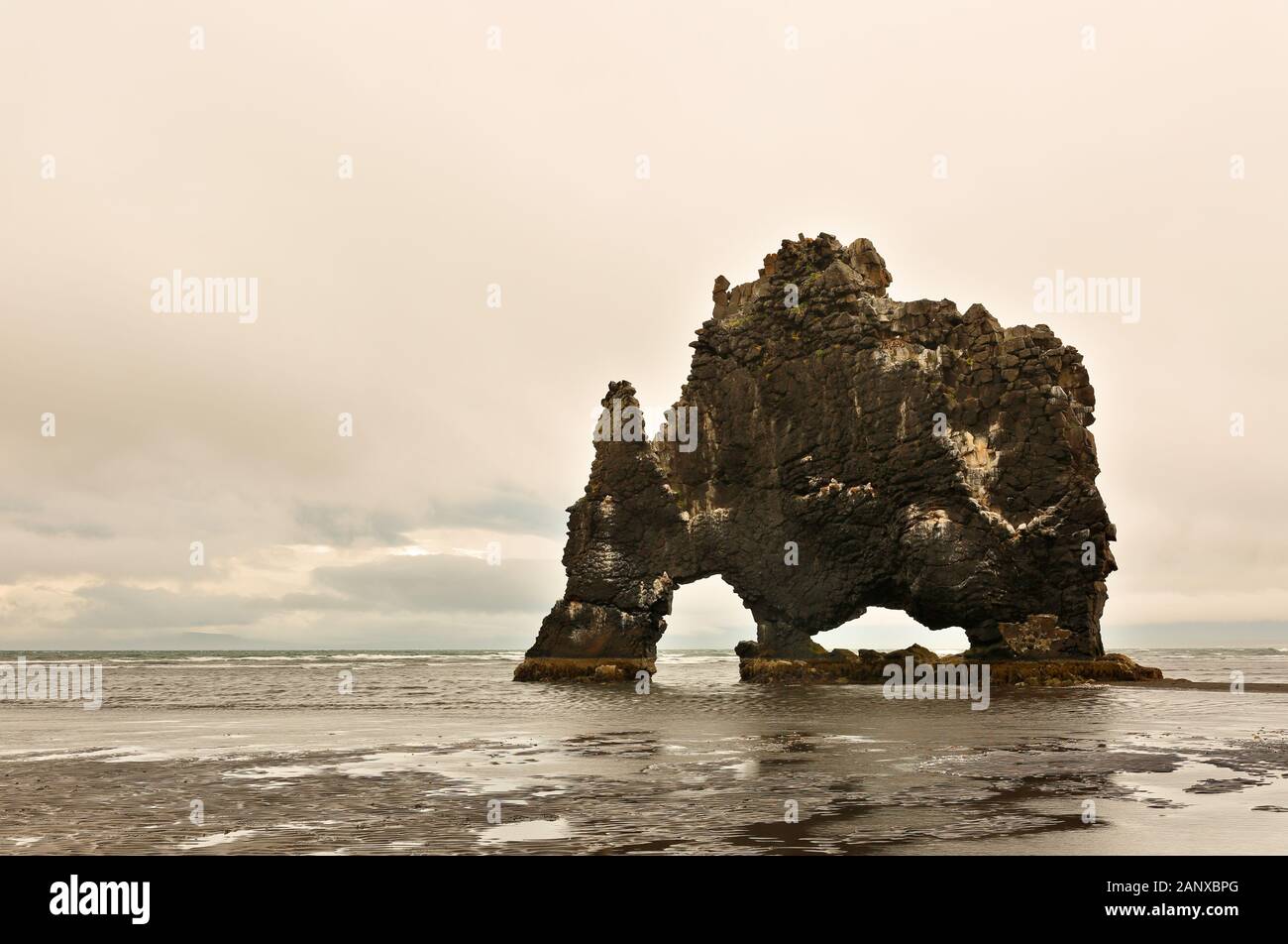 Hvitserkur Rock on a Cloudy Morning. Hvitserkur is a 15 m high basalt stack along the eastern shore of the Vatnsnes peninsula, in northwest Iceland. Stock Photo