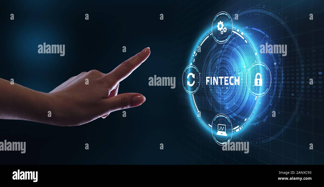 Fintech -financial technology concept.Young businessman  select the icon Fintech on the virtual display. Stock Photo