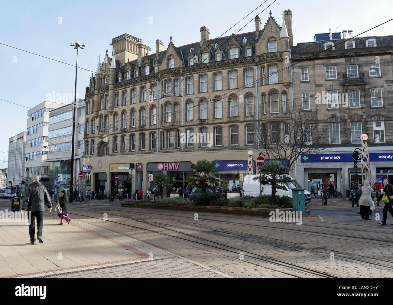 Shops and pedestrians in Sheffield City centre on High St, England UK Stock Photo