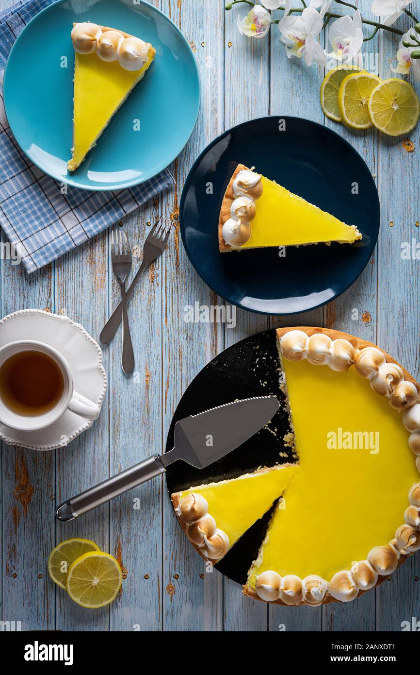 Lemon pie from above for breakfast next to to the sunny window Stock Photo