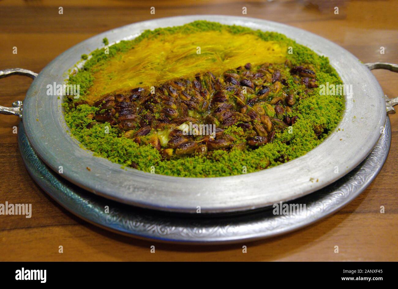 Traditional turkish dessert kunefe, kunafa, kadayif with pistachio