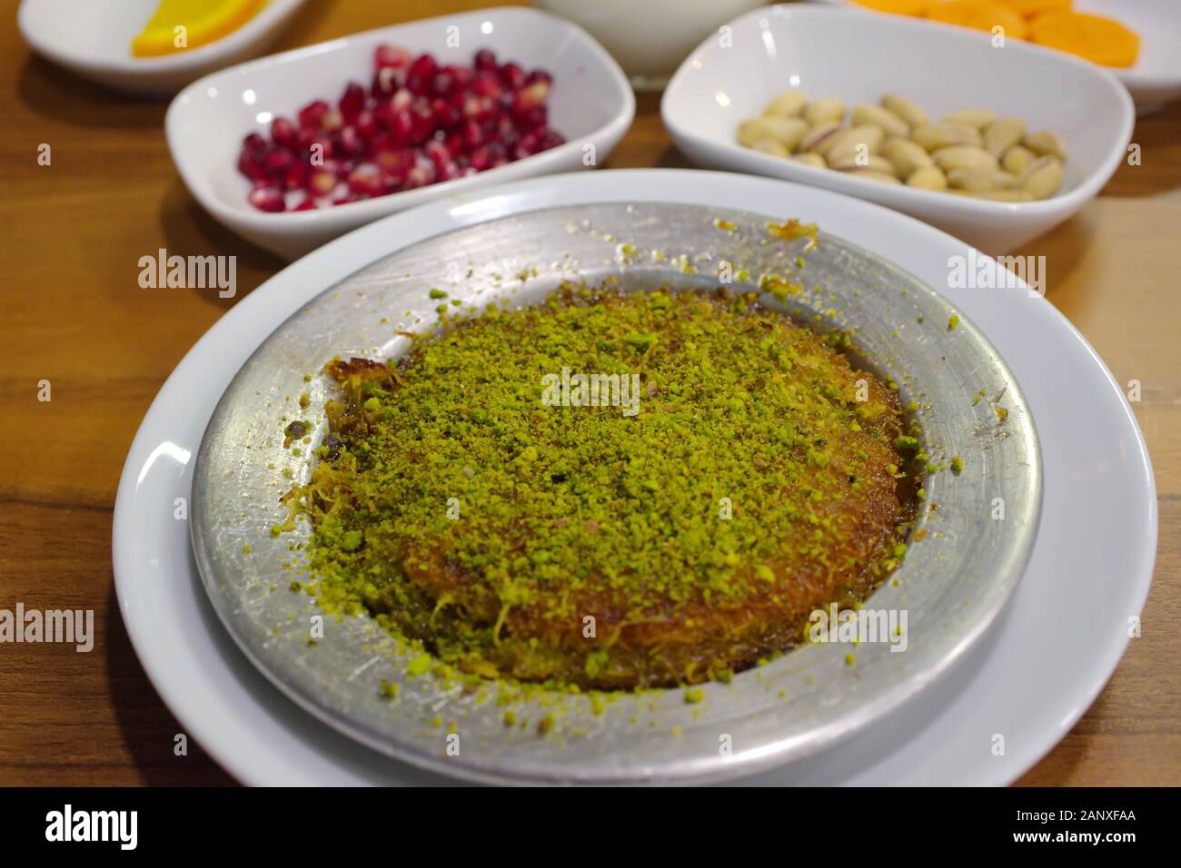 Traditional turkish dessert kunefe, kunafa, kadayif with pistachio