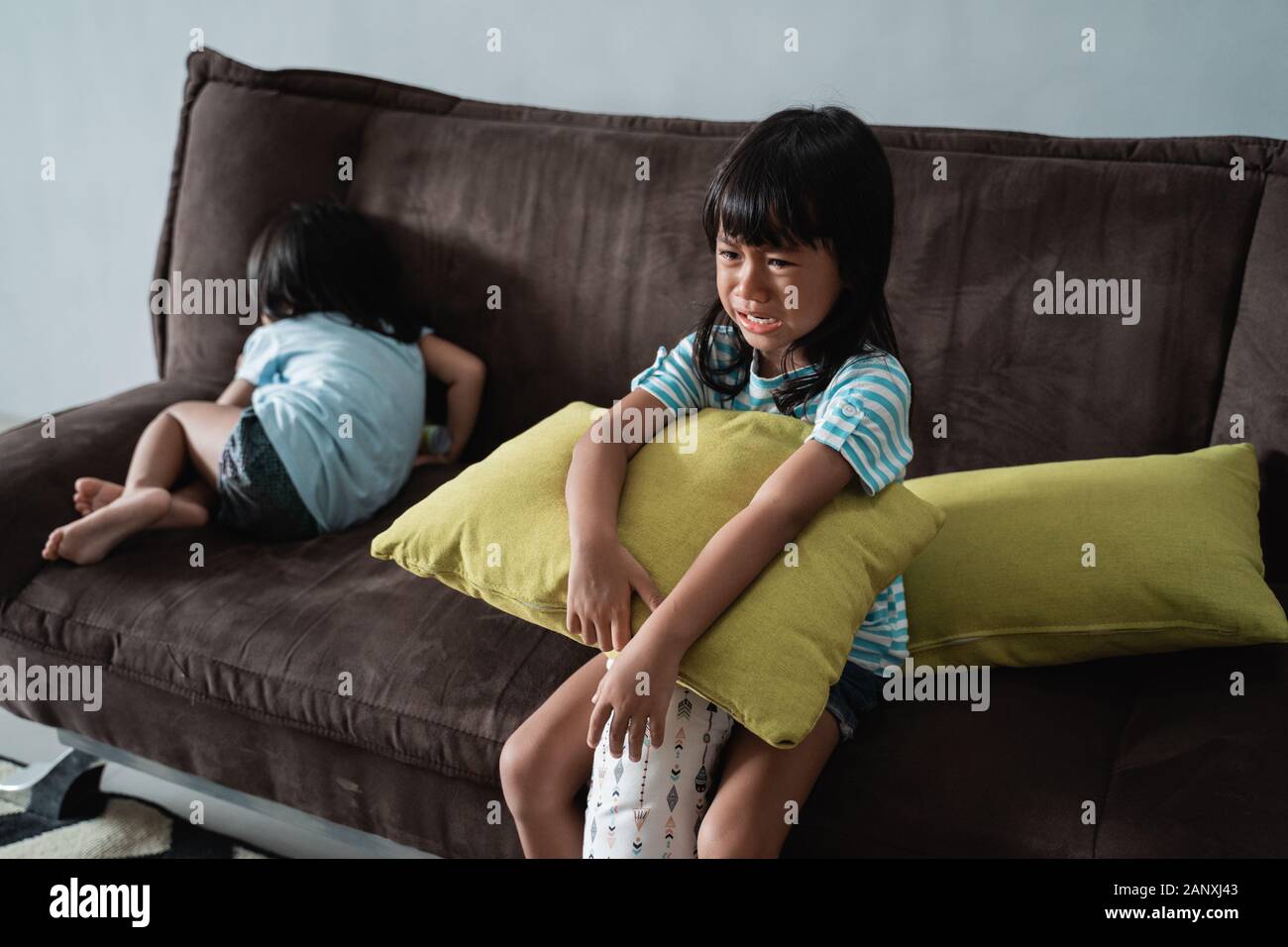 Kids Fight And Cry At Home Stock Photo Alamy