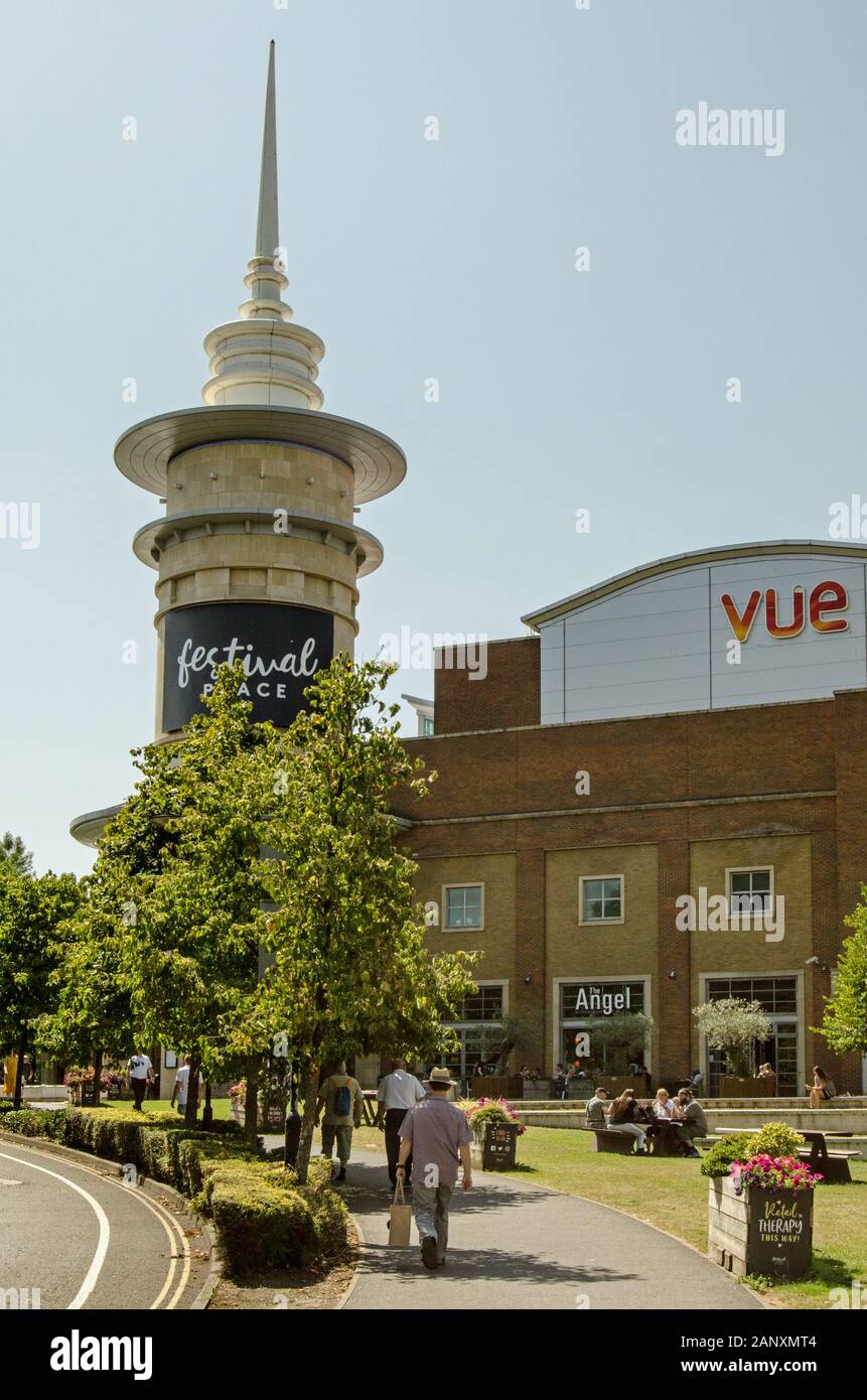 Basingstoke, UK - July 23, 2019:  Pedestrians enjoying the sunshine outside the landmark Festival Place shopping centre in Basingstoke, Hampshire. The Stock Photo