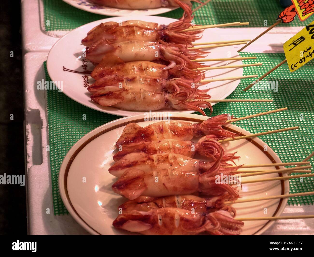 grilled baby squid for sale at nishiki market in kyoto Stock Photo - Alamy