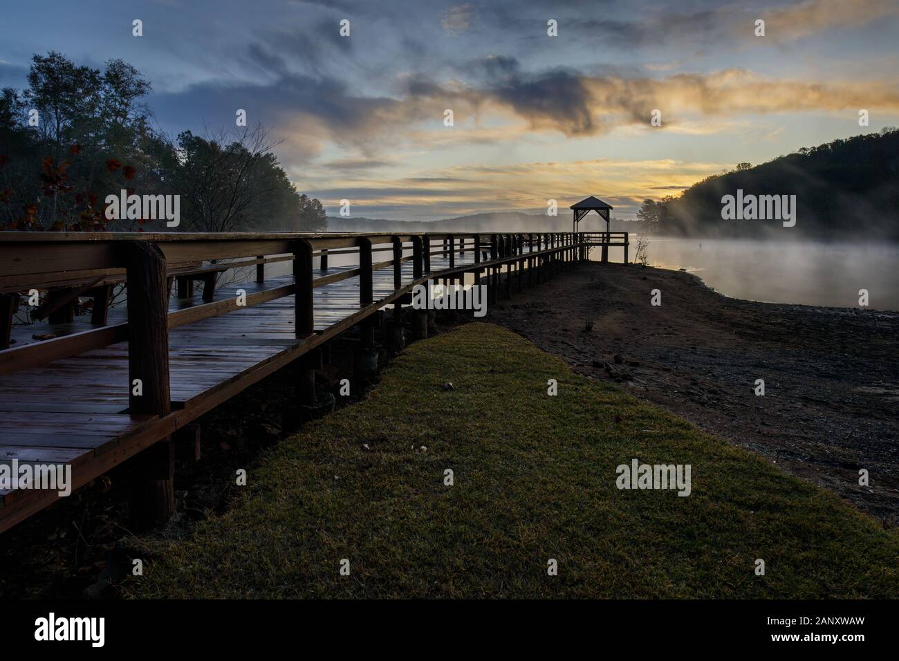 Sunrise, Lake Sidney Lanier. Autumn sunrise along the pier at War Hill Park. War Hill Park is a large park on the north end of Lake Lanier in Dawsonvi Stock Photo