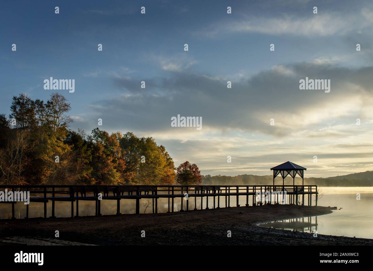Sunrise, Lake Sidney Lanier. Morning sunlight lighting the shores at War Hill Park. War Hill Park is a large park on the north end of Lake Lanier in D Stock Photo