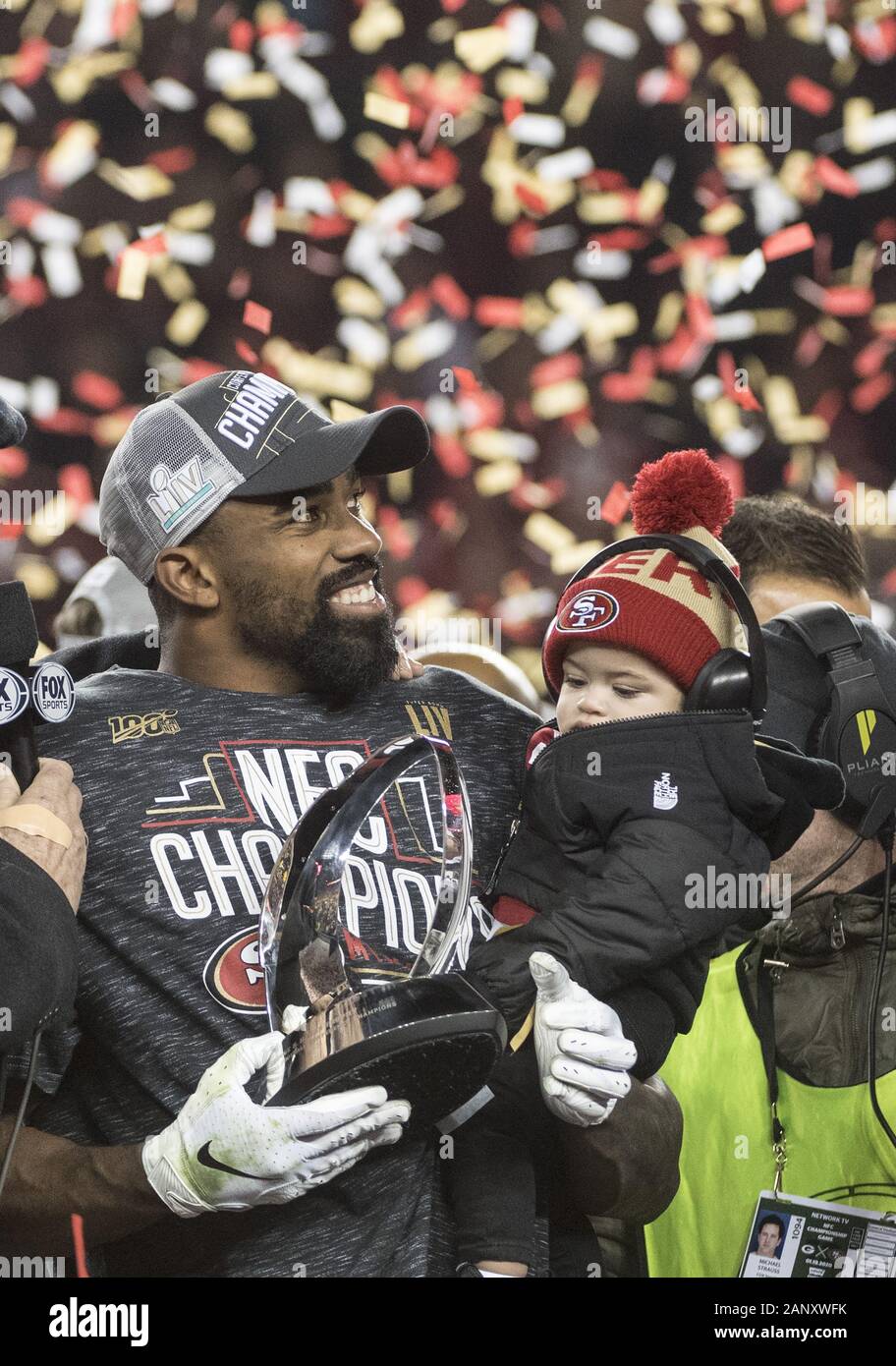 Santa Clara, United States. 19th Jan, 2020. MVP San Francisco 49ers running back Raheem Mostert holds the George Halas Trophy and his son Gunner ater the 49ers won the NFC Championship by defeating the Green Bay Packers 37-20 at Levi's Stadium in San Jose, California on a Sunday, January 19, 2020. Photo by Terry Schmitt/UPI Credit: UPI/Alamy Live News Stock Photo