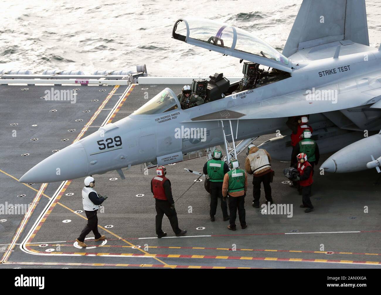 ATLANTIC OCEAN (Jan. 19, 2020) Sailors assigned to USS Gerald R. Ford (CVN 78) and the 'Salty Dogs' of Test and Evaluation (TE) Squadron (VX) 23 welcome Cmdr. Rodrigo Simoes after he lands the E/A-186 Growler. Ford is currently conducting Aircraft Compatibility Testing to further test its Electromagnetic Aircraft Launch Systems (EMALS) and Advanced Arresting Gear (AAG). (U.S. Navy photo by Mass Communication Specialist 2nd Class Indra Beaufort) Stock Photo