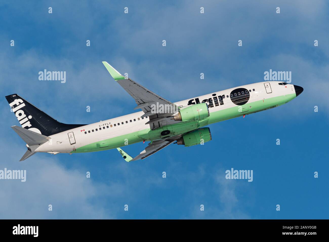 Flair Airlines plane Boeing 737 (737-800) single-aisle narrow body jet airliner airborne after take-off Stock Photo