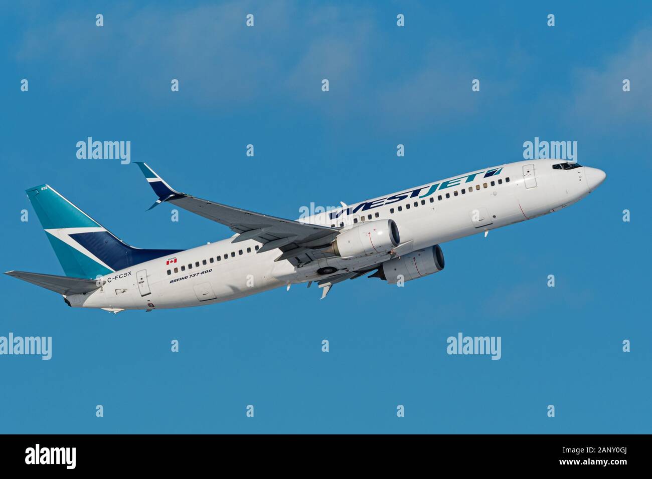 WestJet Airlines plane Boeing 737 (737-800) single-aisle narrow body jet airliner airborne after take-off Stock Photo