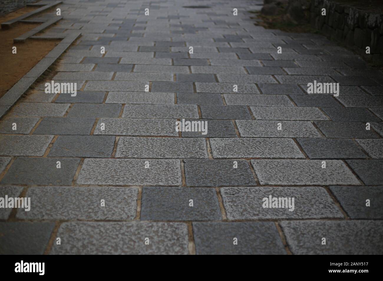 granite stone slabs pedestrian walkway. grey colour paved stone walkway ...