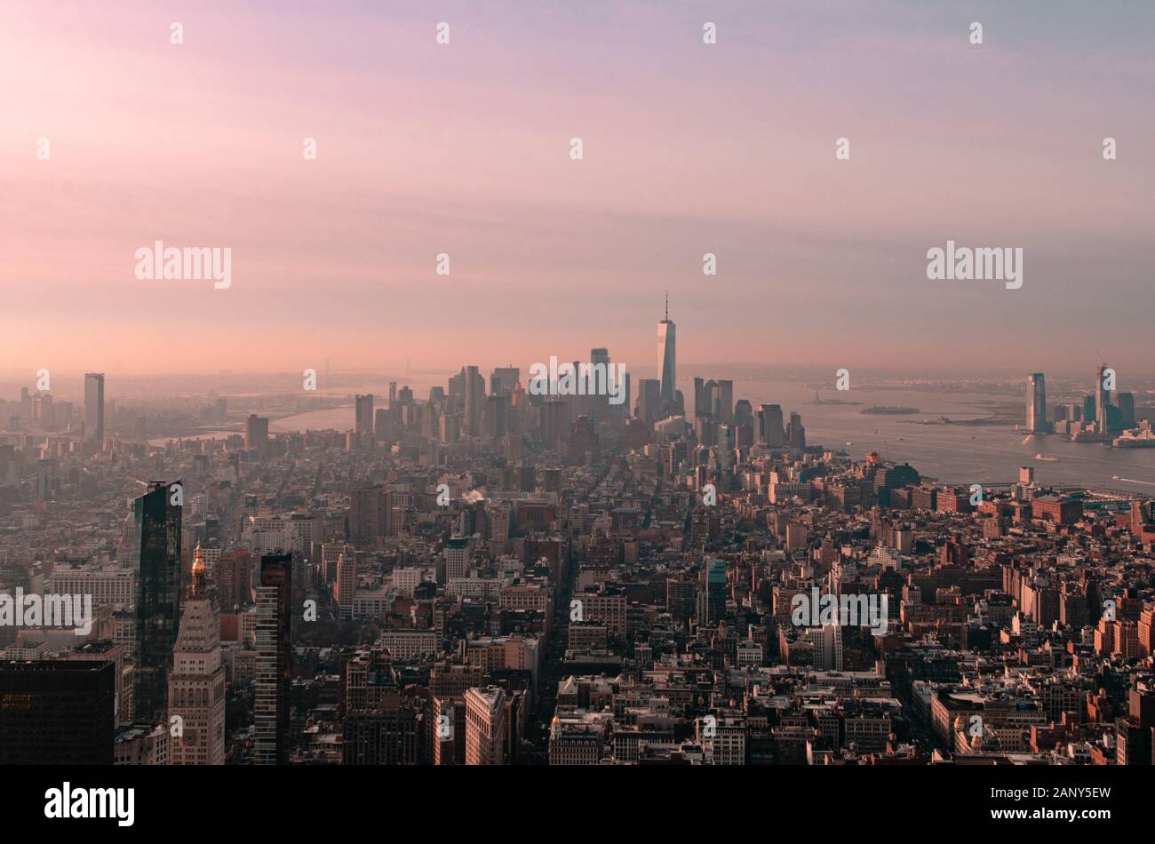 Cotton candy pink and purple sunrise of the Manhattan New York City skyline taken from the Empire State Building observation deck Stock Photo