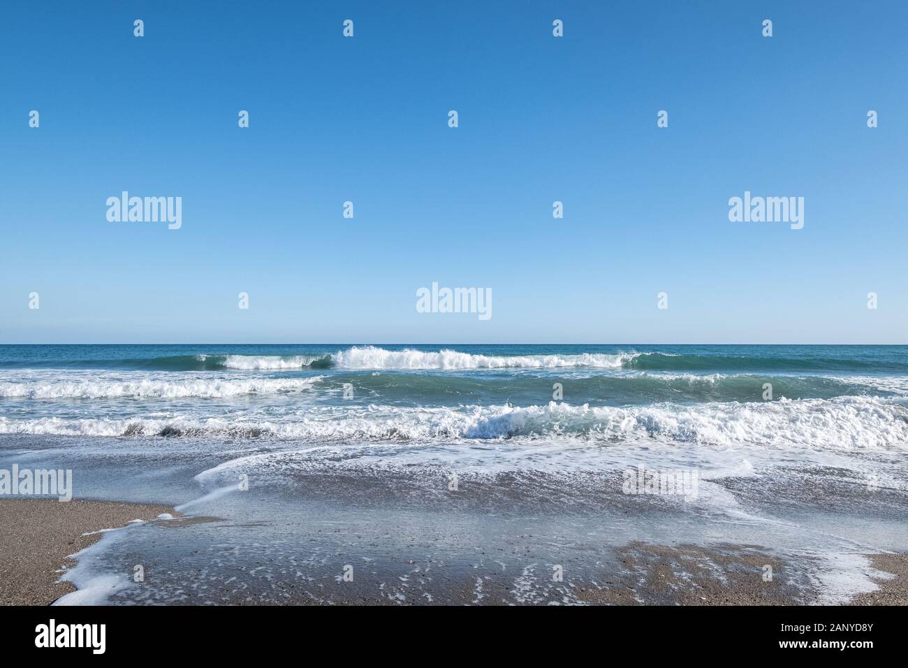 Blue sea waves in sunshine hi-res stock photography and images - Alamy
