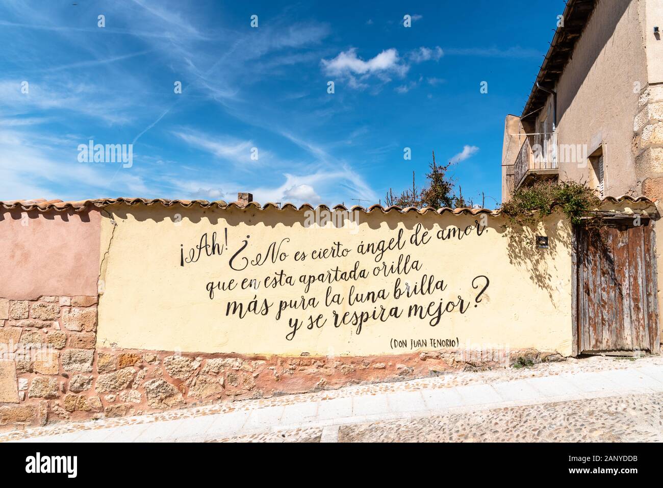 Lerma, Spain - April 16, 2019: A quote from Don Juan Tenorio written on a wall of the medieval town: 'Is it not true, angel of love, that on this shor Stock Photo