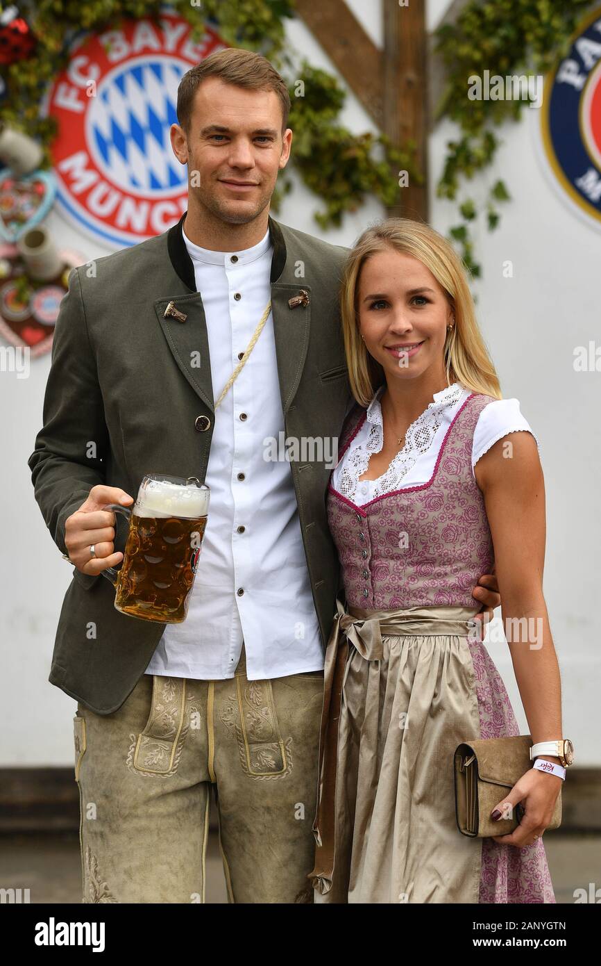 Manuel NEUER (goalwart FC Bayern Munich) with wife Nina in Bavarian costume, lederhosen. Dirndl. Football FC Bayern Mu enchen, traditional Oktoberfest visit to the Kaefer Schenke, on October 6th, 2019 in Muenchen/Germany. Â | usage worldwide Stock Photo