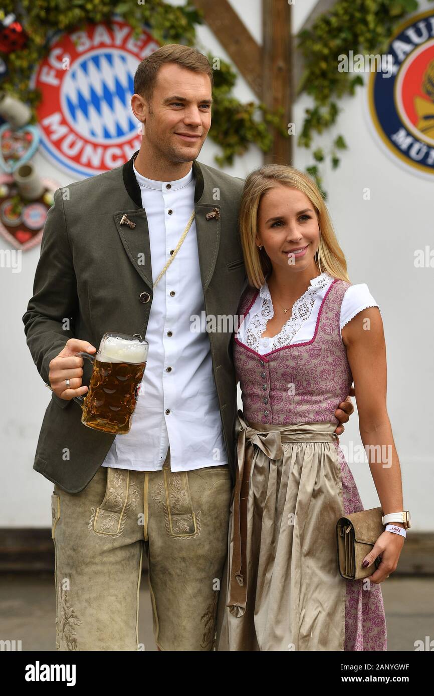 Manuel NEUER (goalwart FC Bayern Munich) with wife Nina in Bavarian costume, lederhosen. Dirndl. Football FC Bayern Mu enchen, traditional Oktoberfest visit to the Kaefer Schenke, on October 6th, 2019 in Muenchen/Germany. | usage worldwide Stock Photo