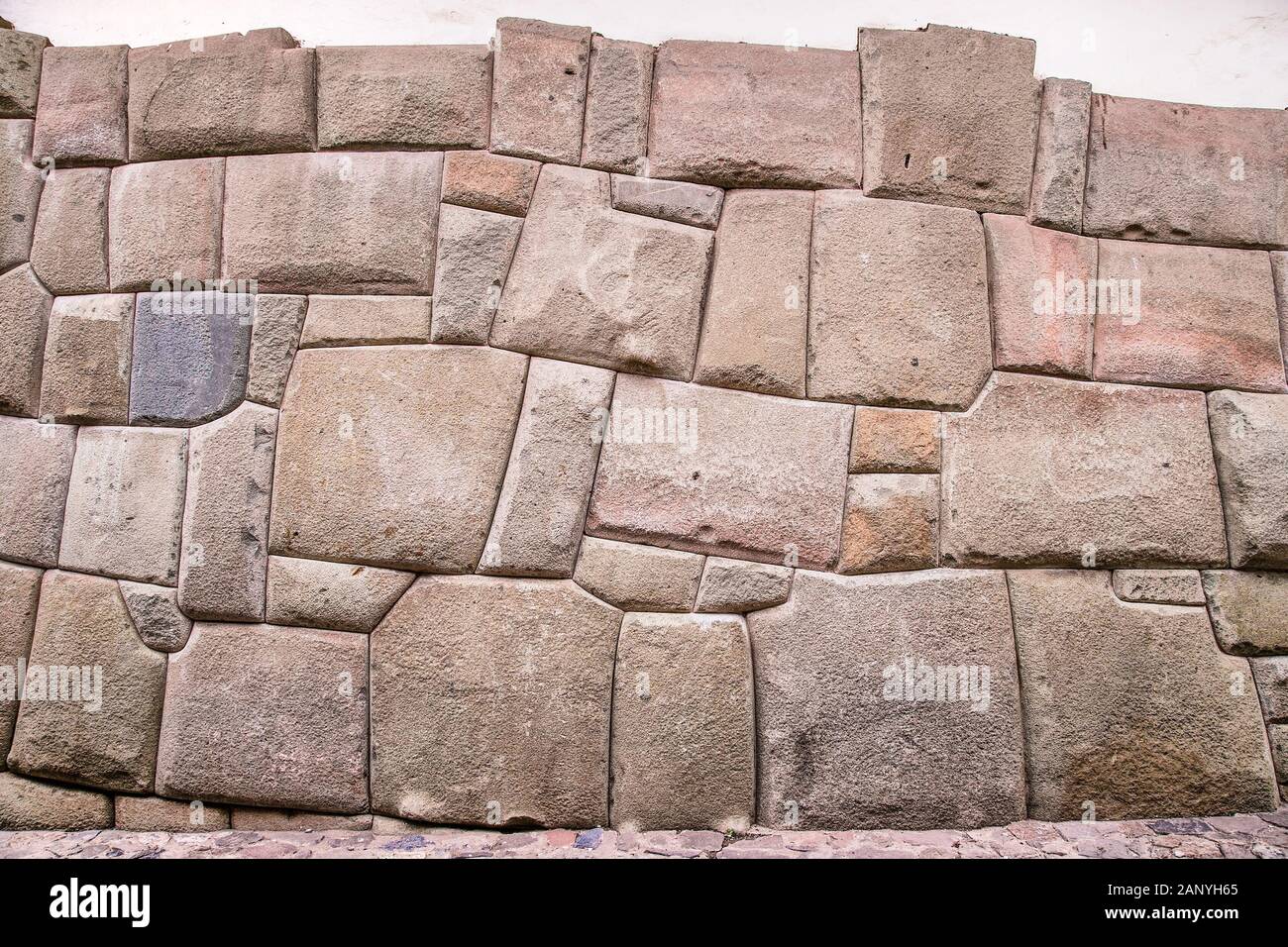Incredible Inca Wall on Hatun Rumiyoc Street, Famous Ancient Street in Cusco, Peru, South America, Archaeological site. Stock Photo