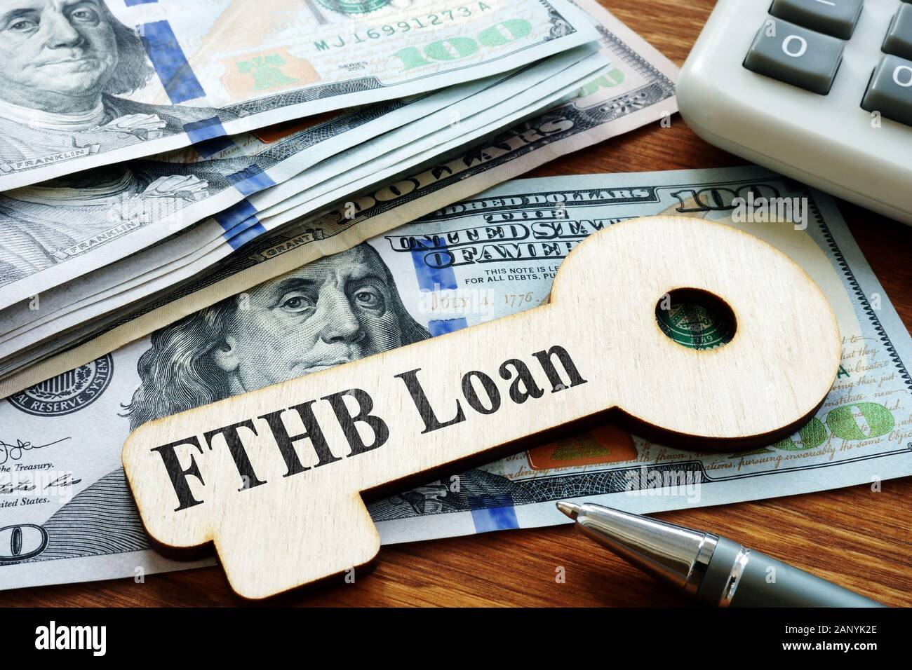 First-Time Homebuyer FTHB Loan printed on the wooden key. Stock Photo