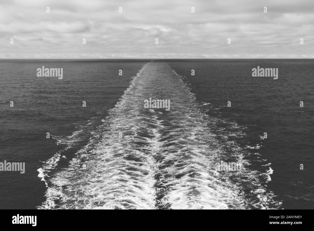 Greyscale shot of a motorboat foam trace in the sea - great for a cool background Stock Photo