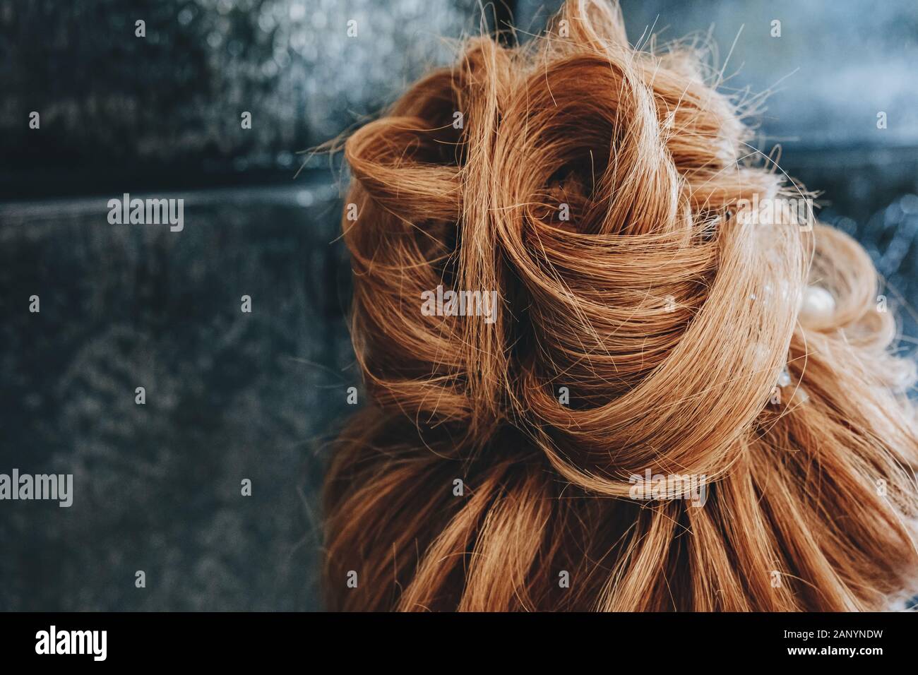 Training hair styling on a mannequin Stock Photo