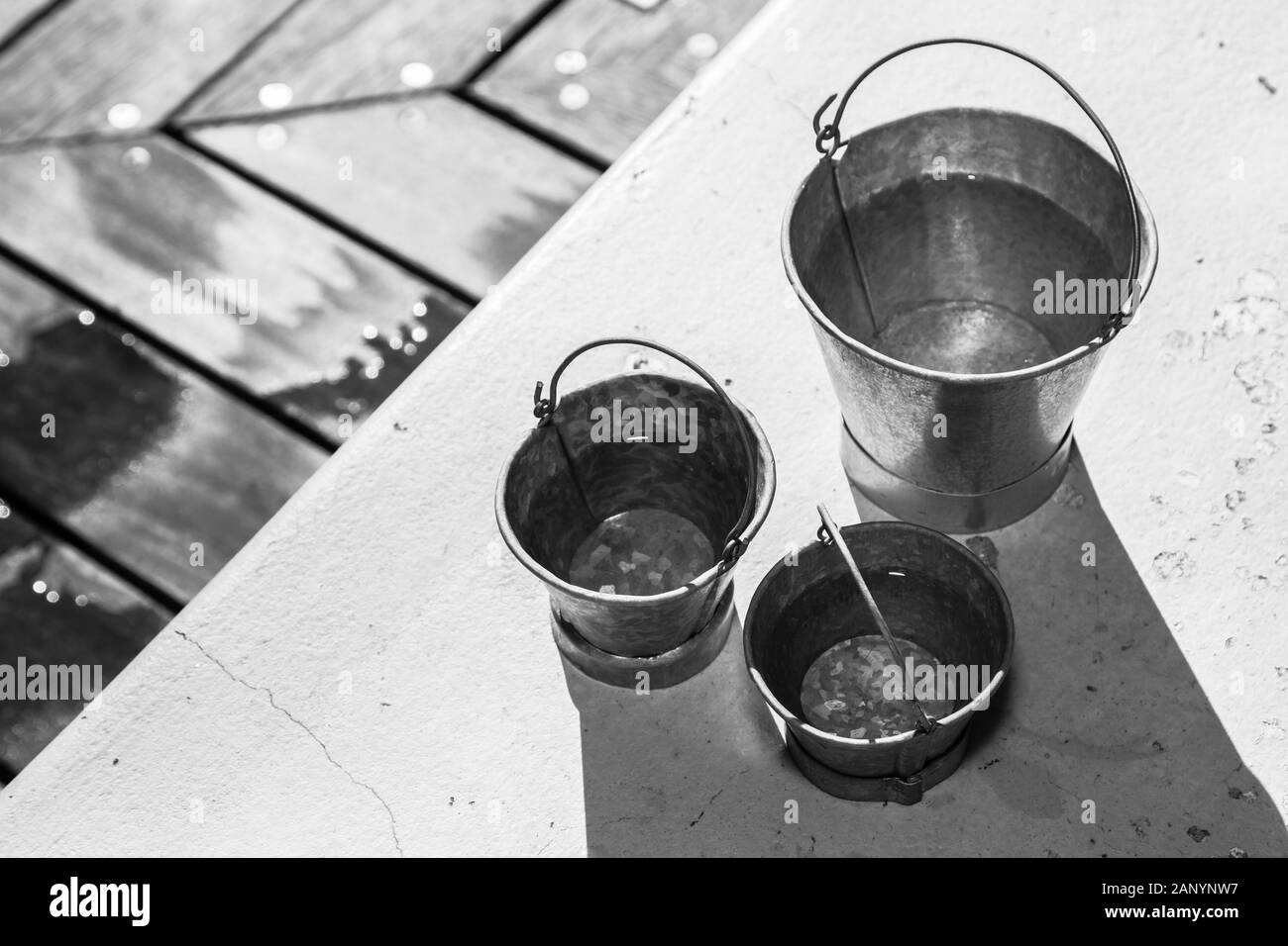 Grayscale shot of different sizes of metal buckets Stock Photo Alamy