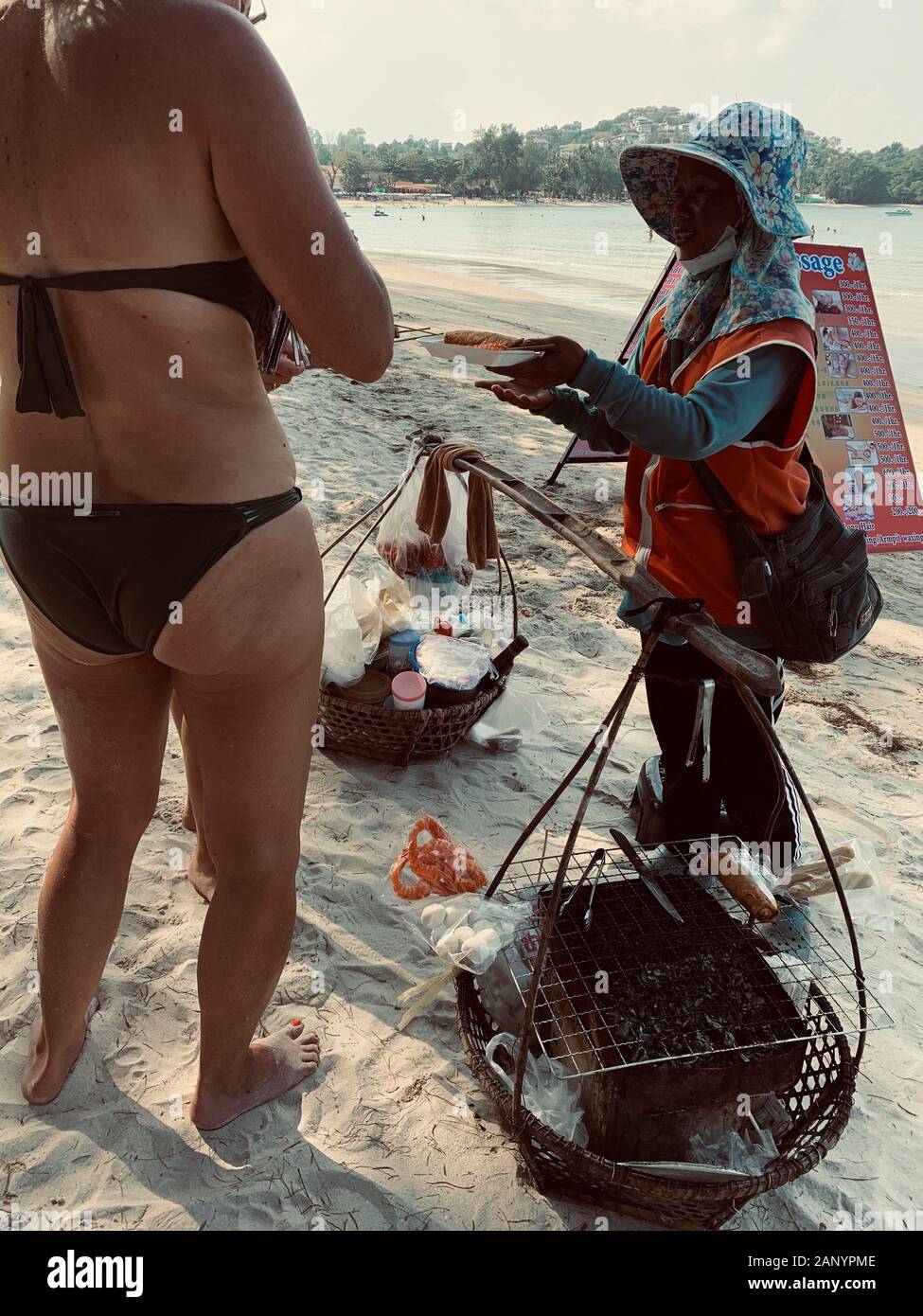 SAMUI, THAILAND - Jan 05, 2020: European tourists in swimwear buying street  food from a local Asian vendor on the Chong Mon beach in Thailand Stock  Photo - Alamy