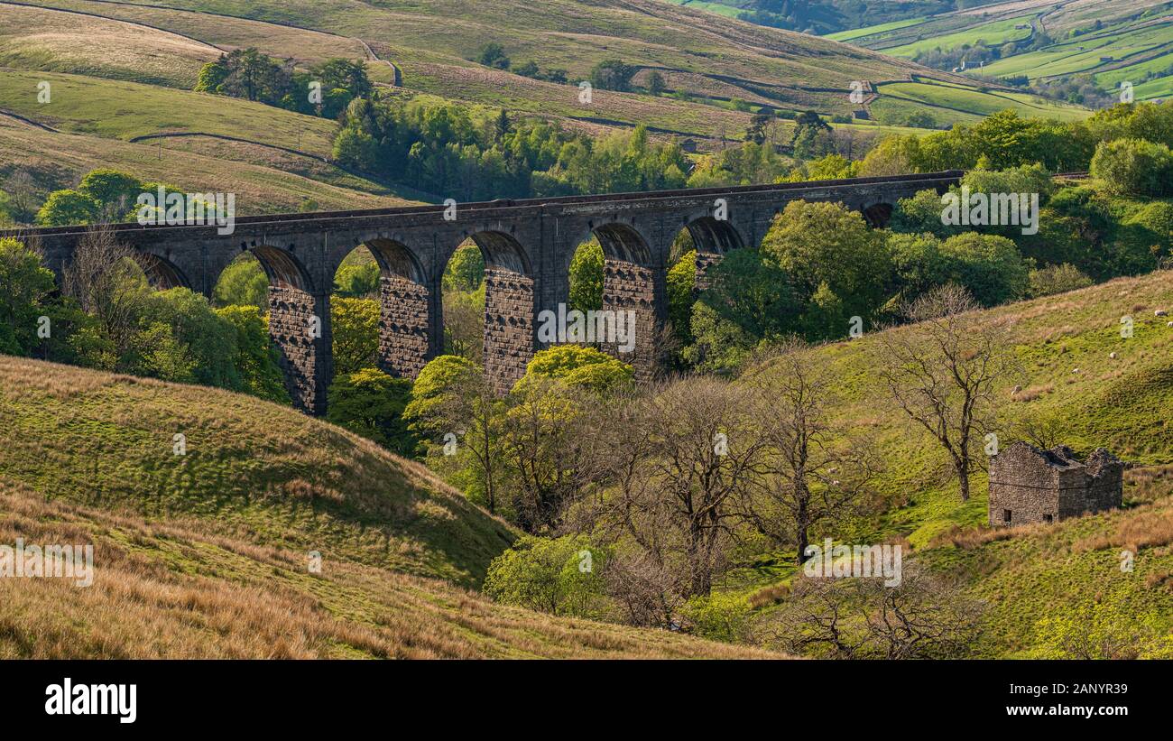 The Dent Head Viaduct with the Dent Dale landscape in the background, near Cowgill, Cumbria, England, UK Stock Photo