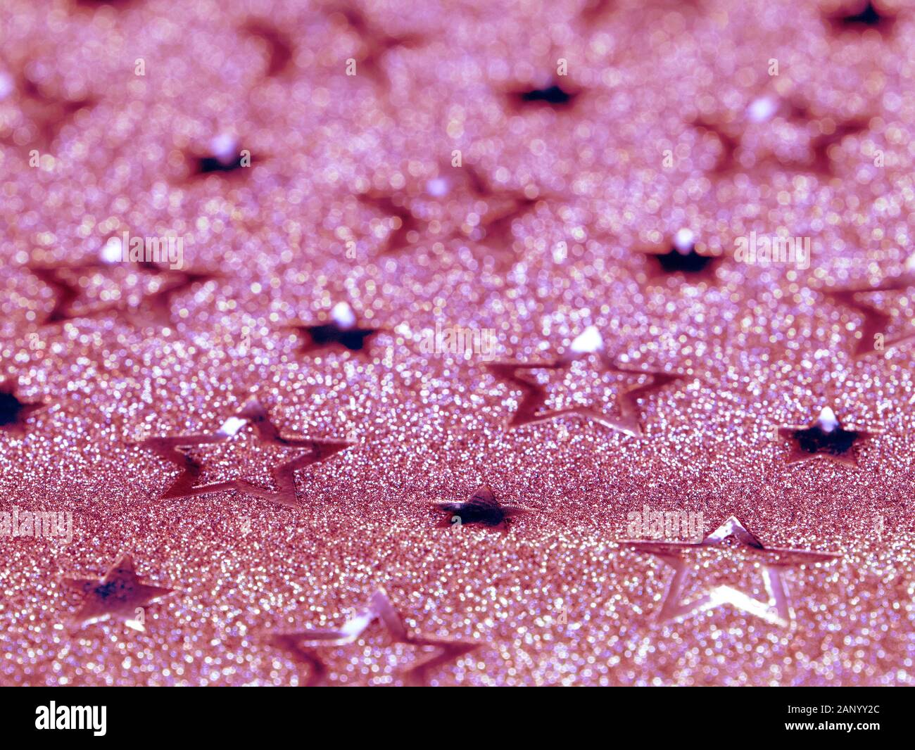 Pink glitter background with stars. Selective focus Stock Photo