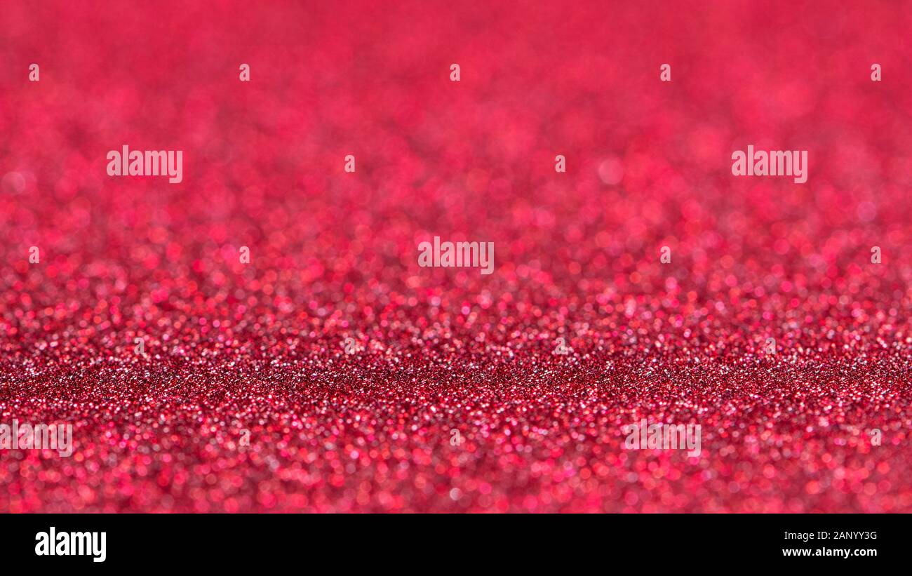 Red glitter background. Selective focus Stock Photo