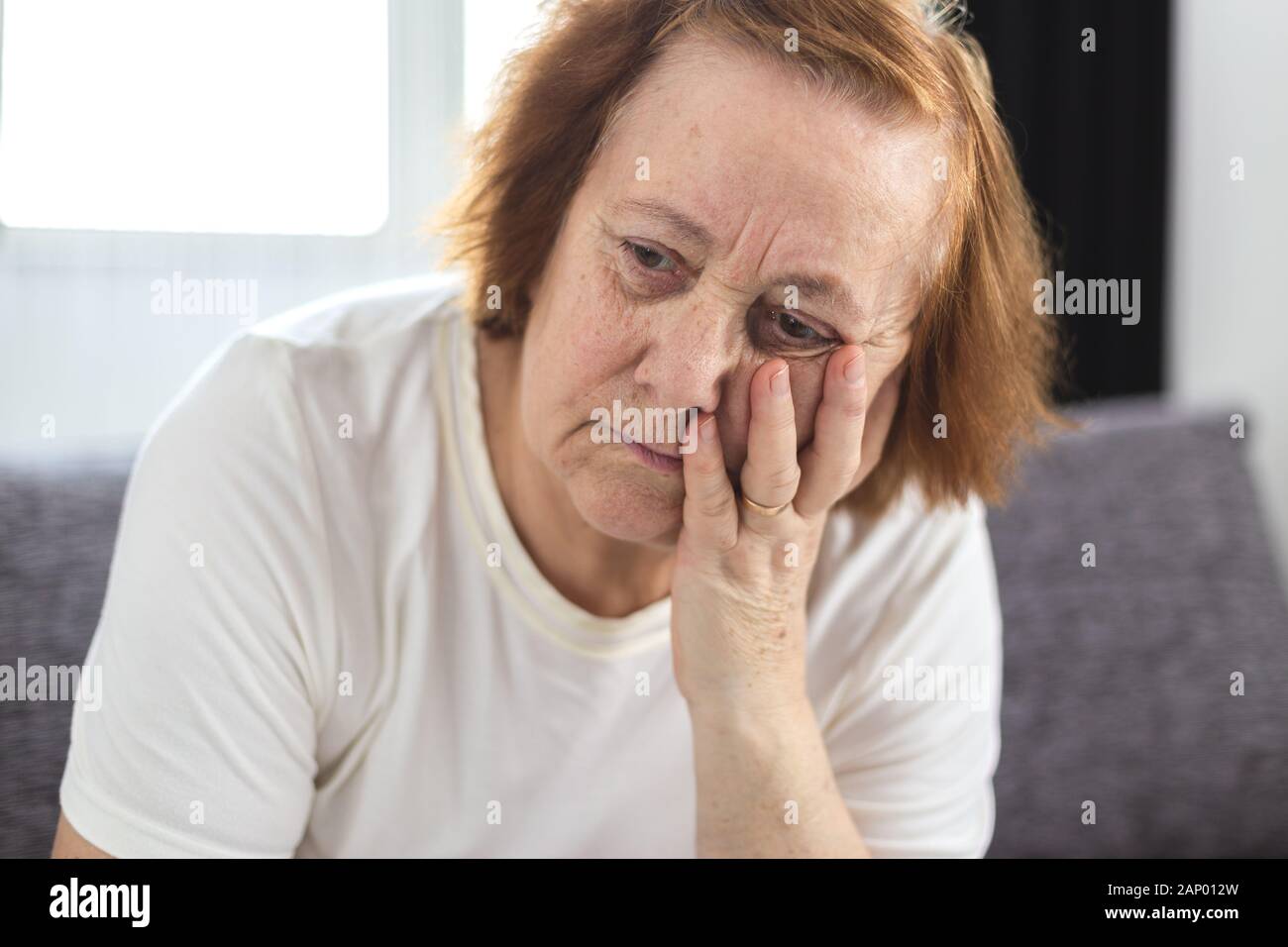Sad concerned elderly woman hi-res stock photography and images - Alamy