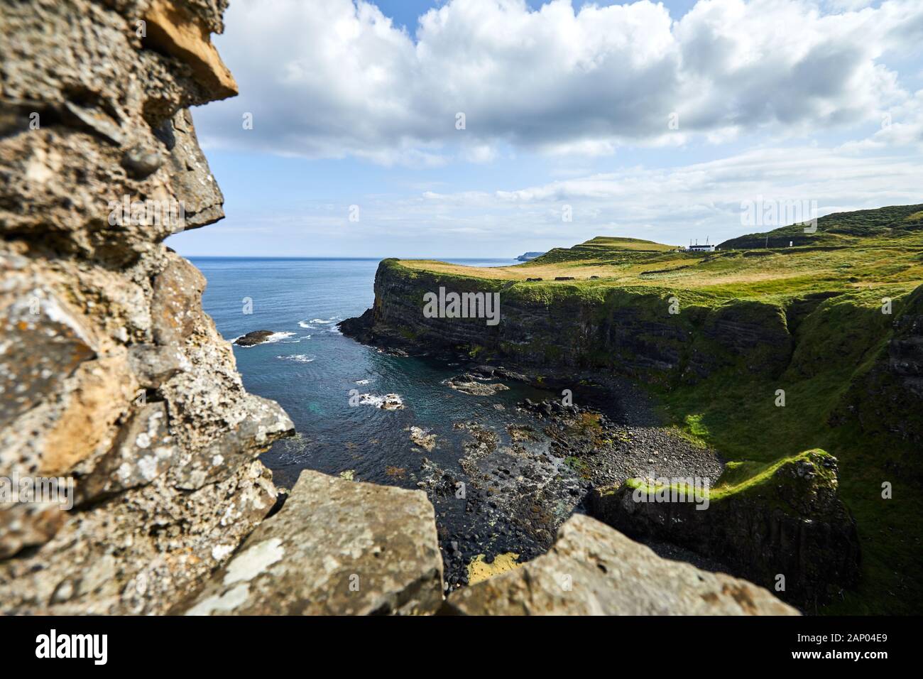 View towards the Giant's Causeway from the ruins of Dunluce Castle, Co Antrim. Stock Photo
