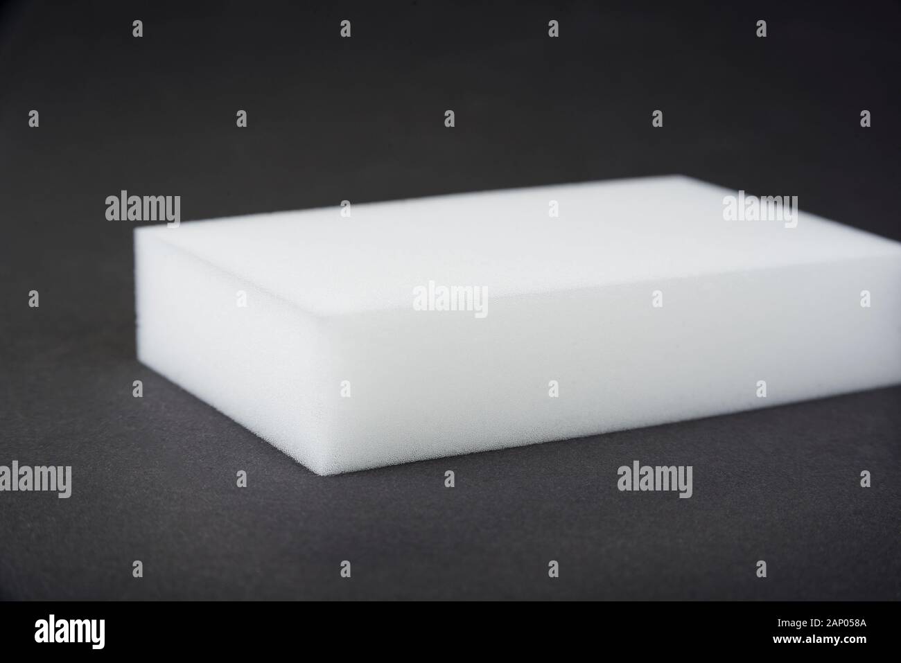 Kitchen melamine sponge on a black background Stock Photo - Alamy