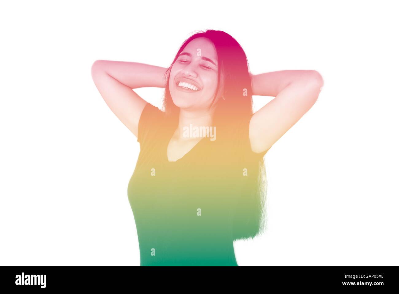 Young diverse girl with hands behind head, smiling with reggae rainbow duotone effect - Millennial woman isolated on white background with copy space and rasta colors - festival and carnival concept Stock Photo