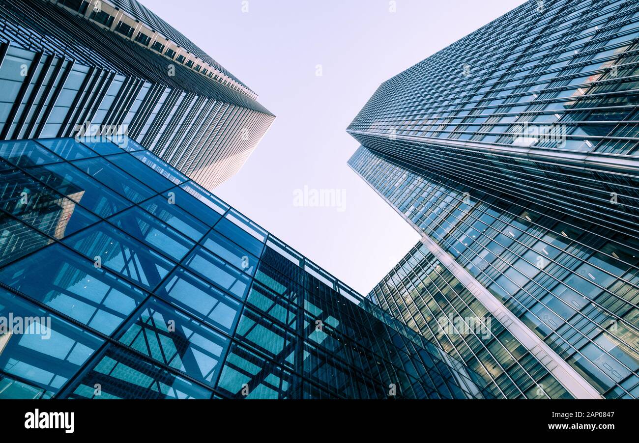 London Docklands skyscrapers. Low, wide angle view of converging glass and steel contemporary skyscrapers. Stock Photo