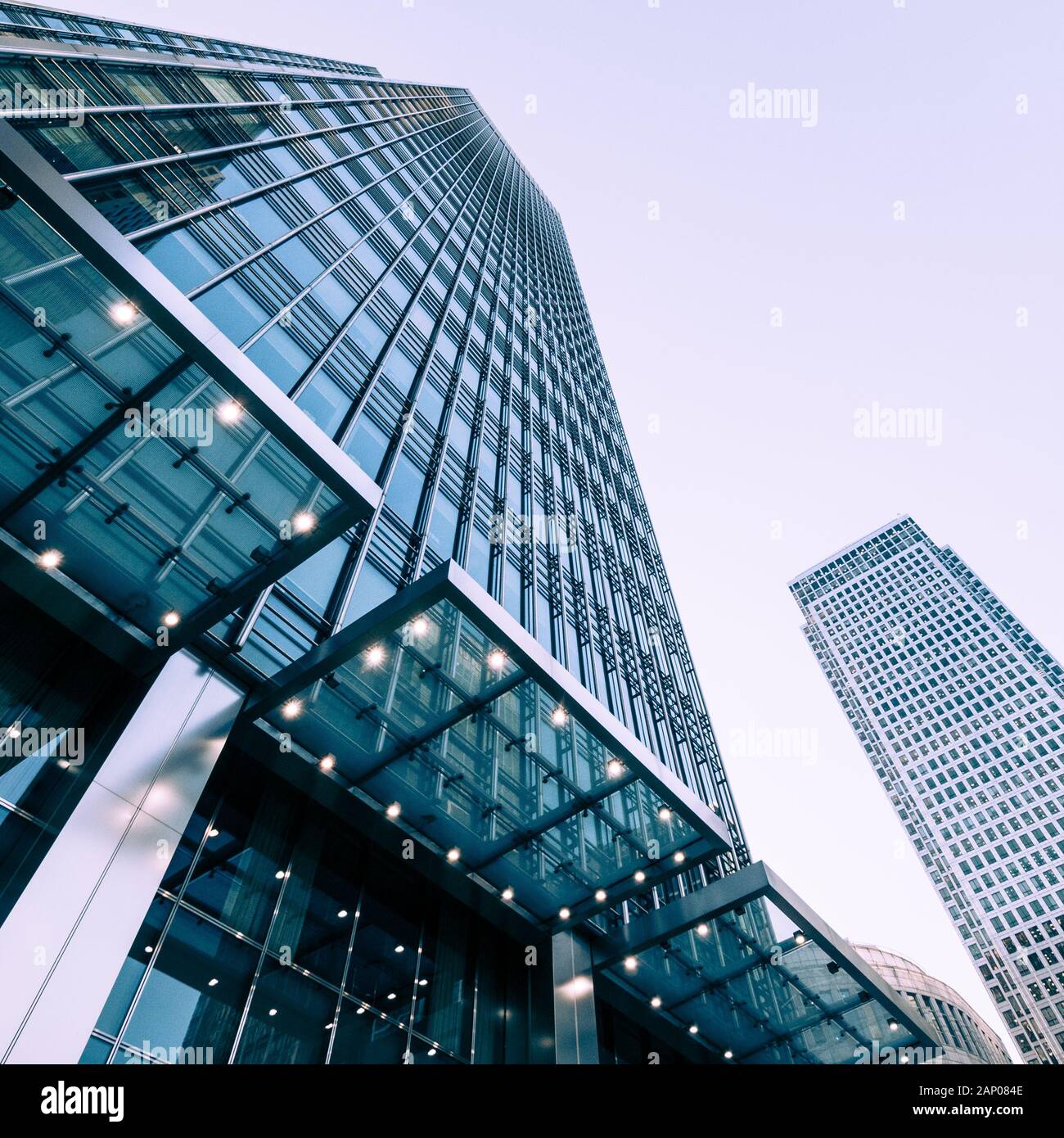 London Docklands skyscrapers. Low, wide angle view of converging skyscrapers with Canary Wharf tower in the background. Stock Photo