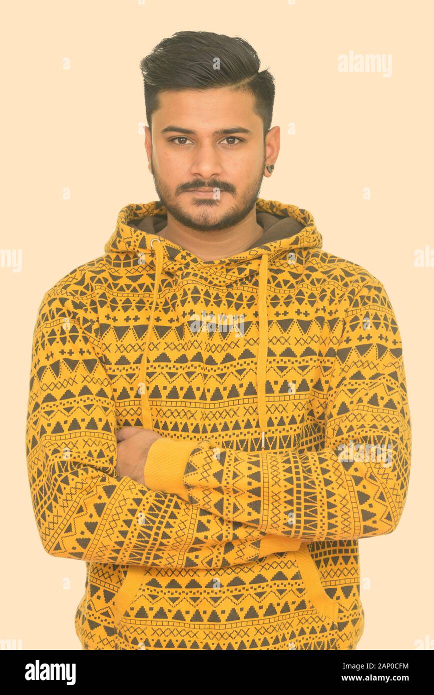 Young handsome Indian man with arms crossed Stock Photo - Alamy