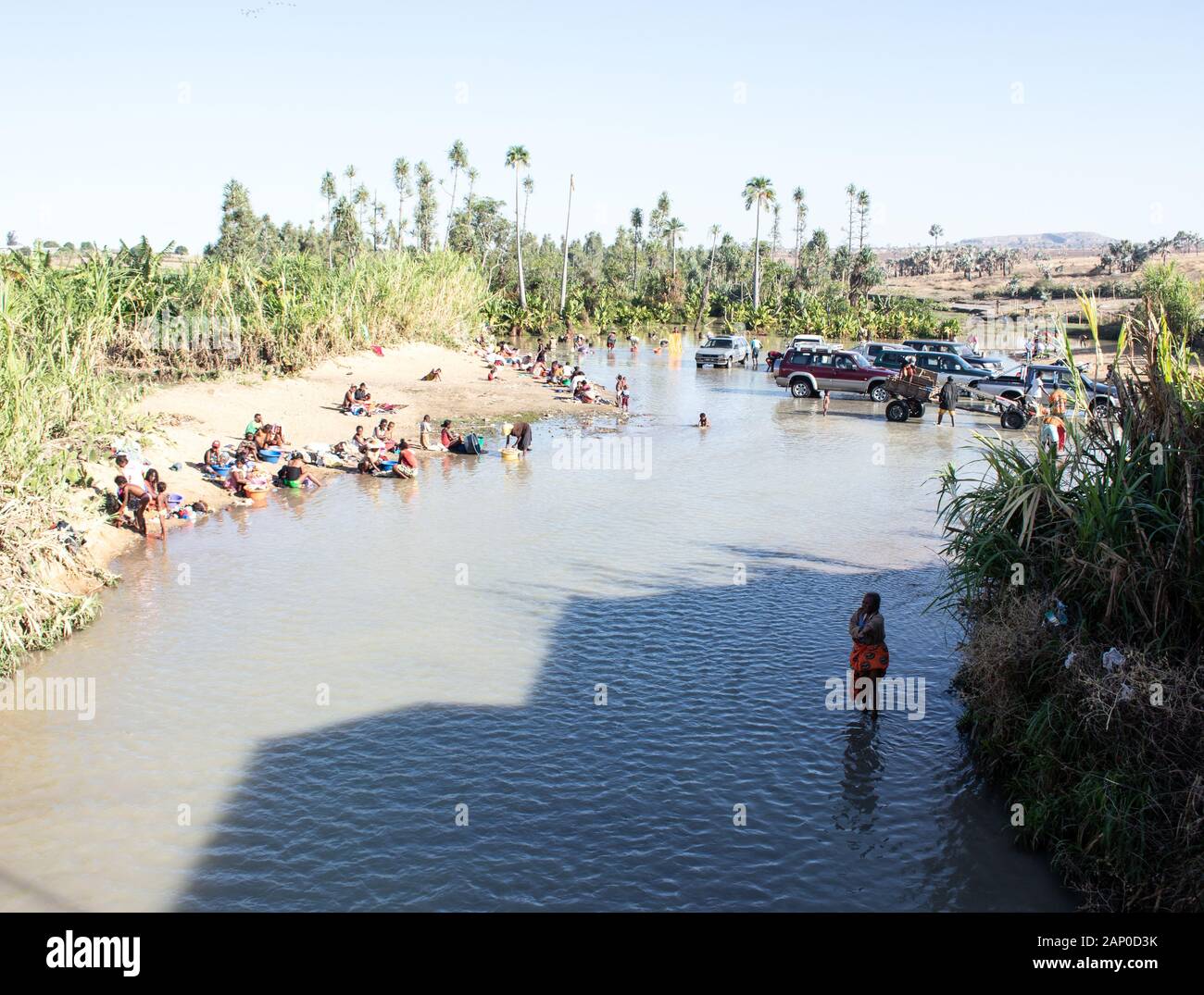 Malagasy people washing clothes in a river in Madagascar Stock Photo