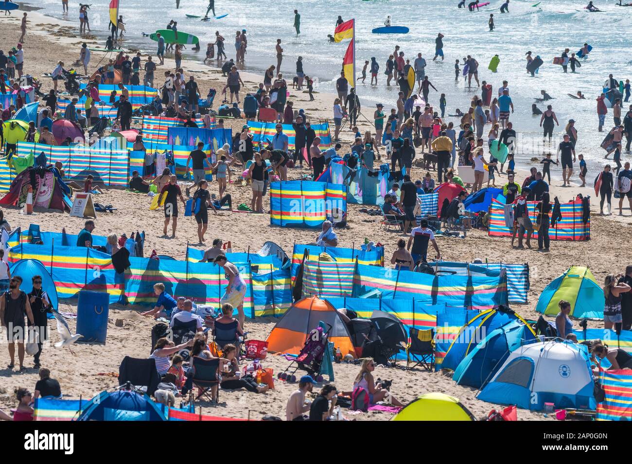 Holidaymakers enjoying themselves on Fistral Beach in Newquay in Cornwall. Stock Photo
