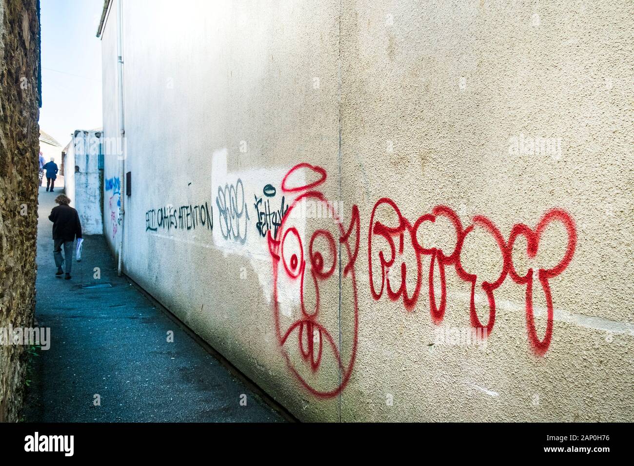 Graffiti sprayed on the side of a building in Truro City Centre in Cornwall. Stock Photo